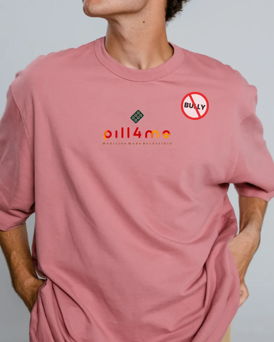 A Pill4Me pink t-shirt carrying the pharmacy logo and an anti-bullying badge, worn for Pink Shirt Day.